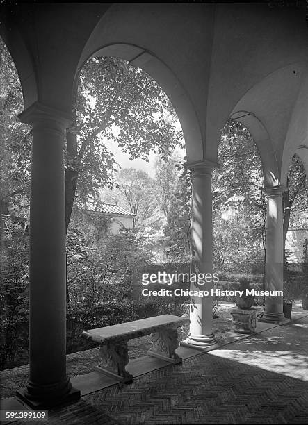 Arches and patio bench at Charles B Pike residence at 955 North Lake Road, Lake Forest, Illinois, 1920s or 1930s.