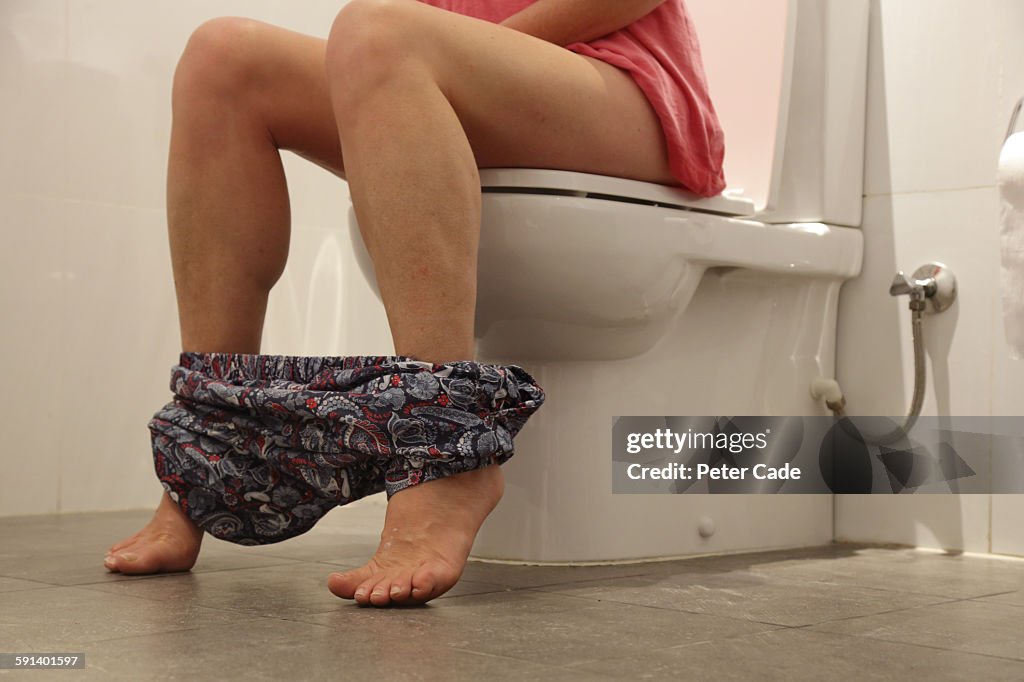 Woman sat on toilet