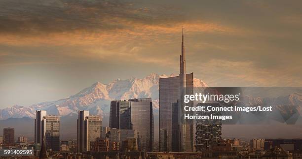 skyscrapers of downtown milan in front of monte rosa, italy - mailand stock-fotos und bilder