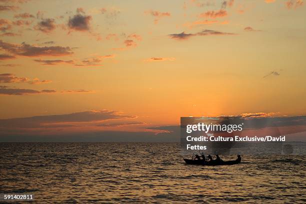 lake malawi at sunset, malawi - lake malawi stock pictures, royalty-free photos & images