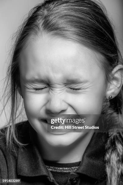 close up of caucasian girl concentrating with eyes closed - child eyes closed stock pictures, royalty-free photos & images