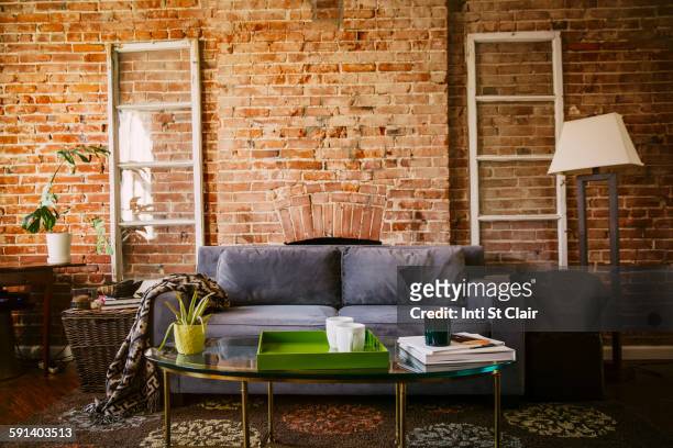coffee table and sofa in modern living room - empty living room stock pictures, royalty-free photos & images