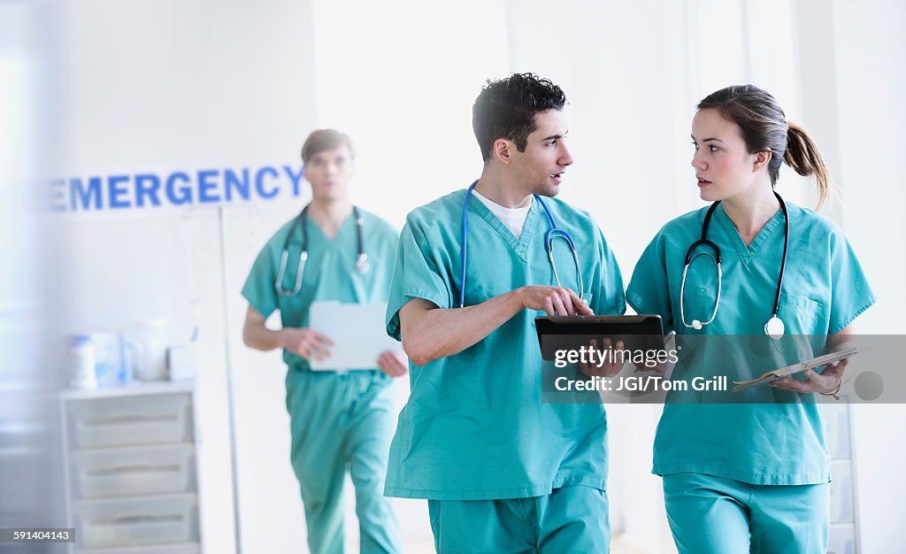 Doctors talking in hospital emergency room