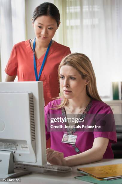 Nurse Ringing Computer 547 Nurse On Computer Serious Stock Photos, High-Res Pictures, and ...
