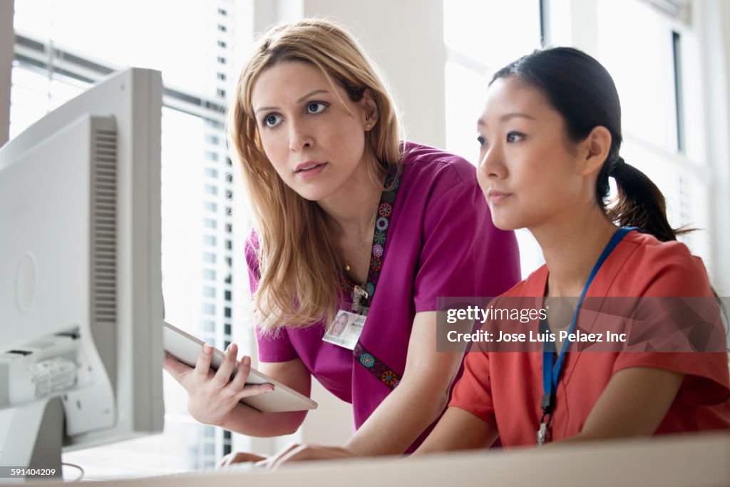 Two Nurses At Computer Nurses Working On Computer In Office High-Res Stock Photo - Getty Images