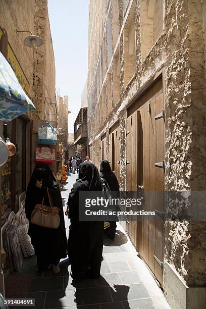 women in hijab walking on doha sidewalk, doha, qatar - hot arabian women stock pictures, royalty-free photos & images