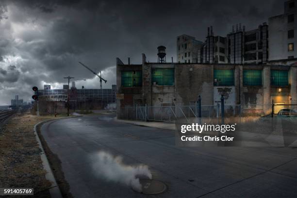 buildings in dilapidated industrial city - detroit michigan night stock pictures, royalty-free photos & images