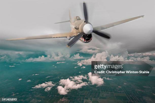 historical plane flying in sky - world war ii stock pictures, royalty-free photos & images