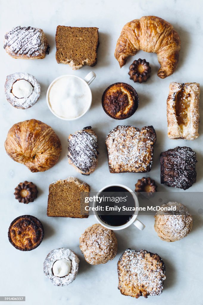 High angle view of variety of pastries and coffee