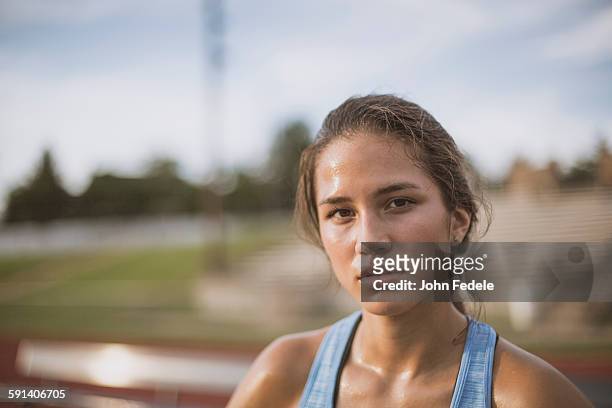 mixed race athlete on sports field - john hale stock pictures, royalty-free photos & images