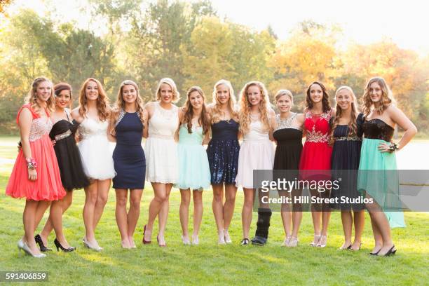 teenage girls smiling before prom - prom dress stockfoto's en -beelden