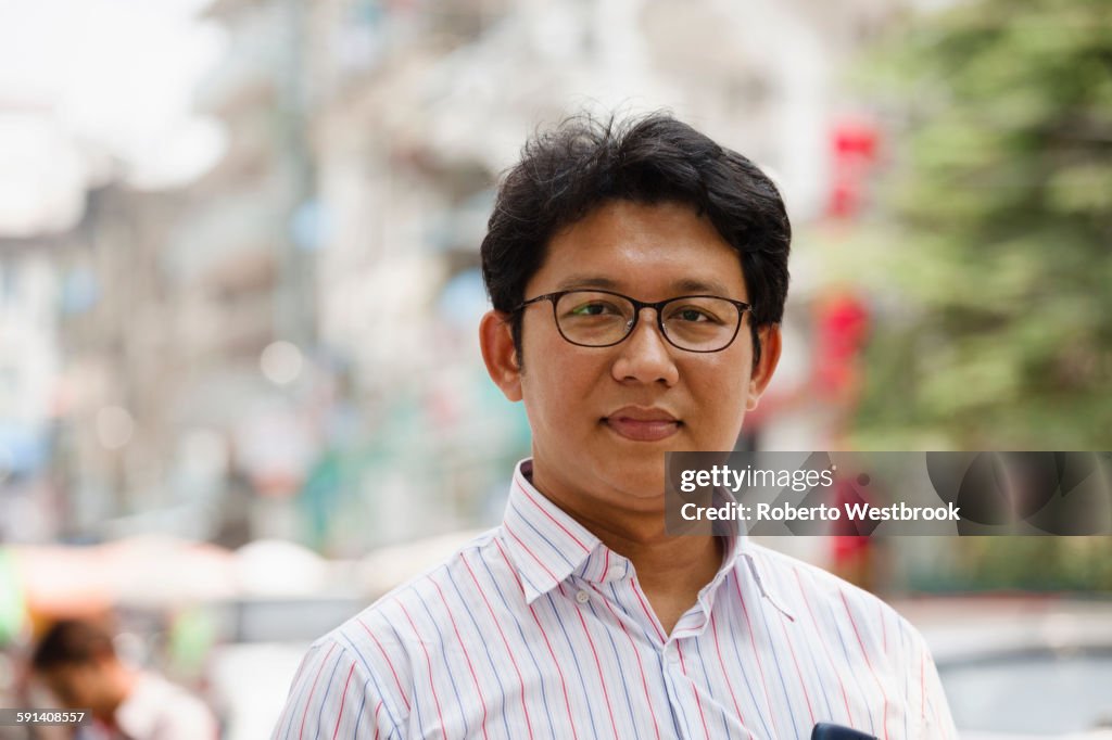 Asian businessman standing in city