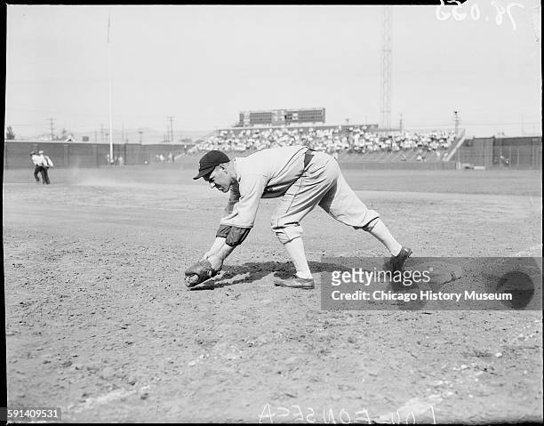 Chicago White Sox baseball manager Lew Fonseca fielding a baseball, circa 1934.