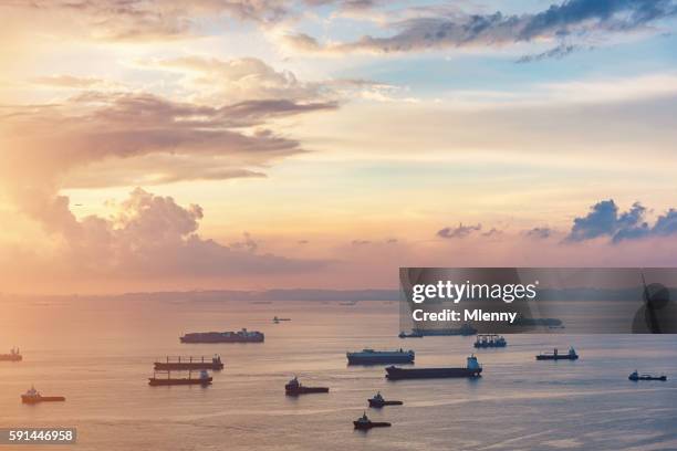 aerial view asian container ships freight transportation sunrise - singapore port stock pictures, royalty-free photos & images