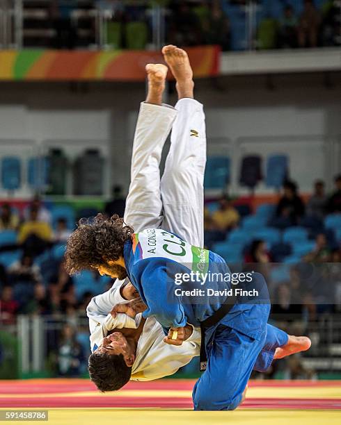 Former world champion, Asley Gonzalez of Cuba defeats Martin Michel of Bolivia by an ippon to win their u90kg elimination contest during day 5 of the...