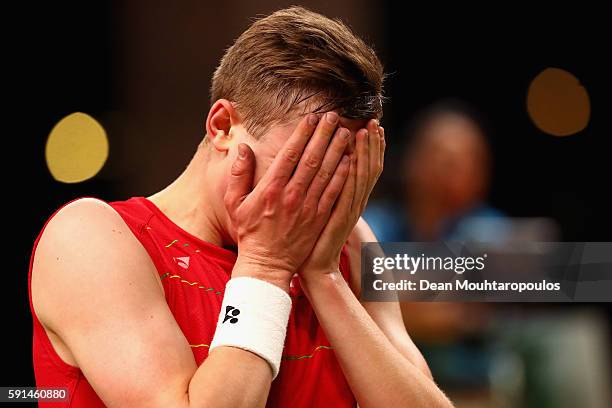 Viktor Axelsen of Denmark reacts after defeating Rajiv Ouseph of Great Britain during the Men's Singles Quarterfinal Badminton match on Day 12 of the...