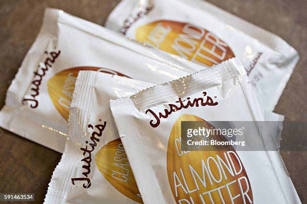 Packets of Justin's almond butter are arranged for a photograph in Tiskilwa, Illinois, U.S., on Monday, Aug. 15, 2016. Hormel Foods Corp., which...