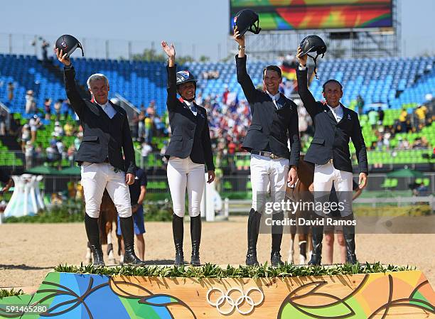 Roger Yves Bost of France riding Sydney Une Prince, Penelope Leprevost of France riding Flora de Mariposa, Kevin Staut of France riding Reveur de...