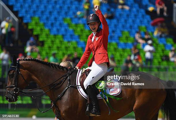 Silver medalist Lucy Davis of United States riding Barron celebrates before the medal ceremony after the Jumping Team competition on Day 12 of the...