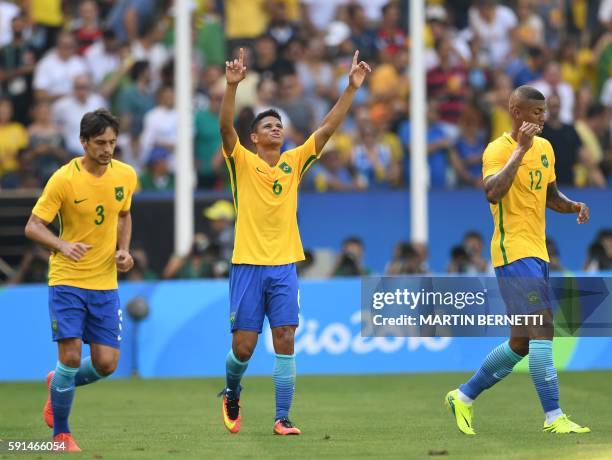 Brazil's Rodrigo Caio, Douglas Santos and Walace celebrate a team's goal against Honduras during their Rio 2016 Olympic Games men's football...