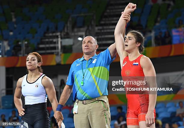 Russia's Natalia Vorobeva celebrates winning against Egypt's Enas Mostafa Youssef Ahmed in their women's 69kg freestyle semi-final match on August 17...