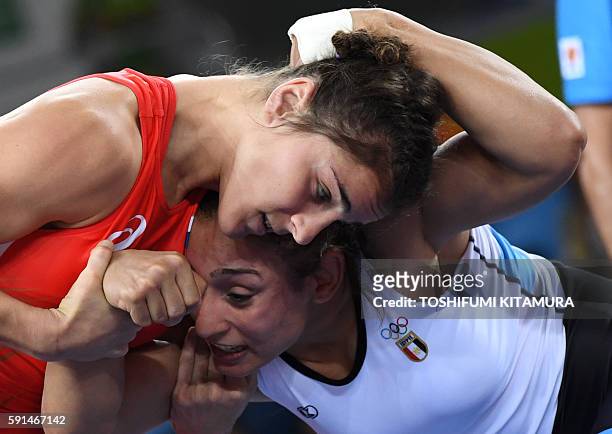 Russia's Natalia Vorobeva wrestles Egypt's Enas Mostafa Youssef Ahmed in their women's 69kg freestyle semi-final match on August 17 during the...