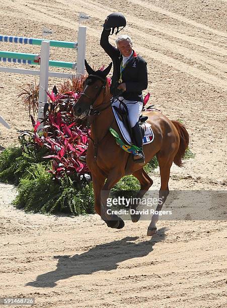 Gold medalists Roger Yves Bost of France riding Sydney Une Prince celebrates after the Jumping Team competition on Day 12 of the Rio 2016 Olympic...
