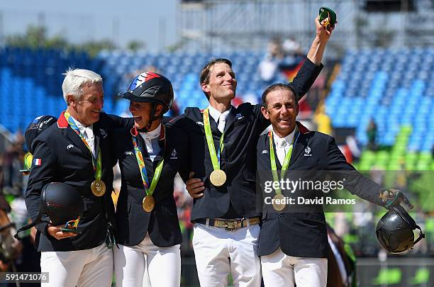 Roger Yves Bost of France riding Sydney Une Prince, Penelope Leprevost of France riding Flora de Mariposa, Kevin Staut of France riding Reveur de...