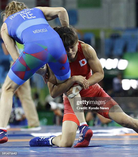 Japan's Kaori Icho faces off against Yuliya Ratkevich of Azerbaijan during a women's freestyle 58-kilogram class semifinal at the Rio de Janeiro...