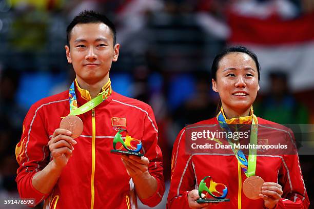 Bronze medalists, Nan Zhang and Yunlei Zhao of China celebrate after the Mixed Doubles Gold Medal Match on Day 12 of the Rio 2016 Olympic Games at...