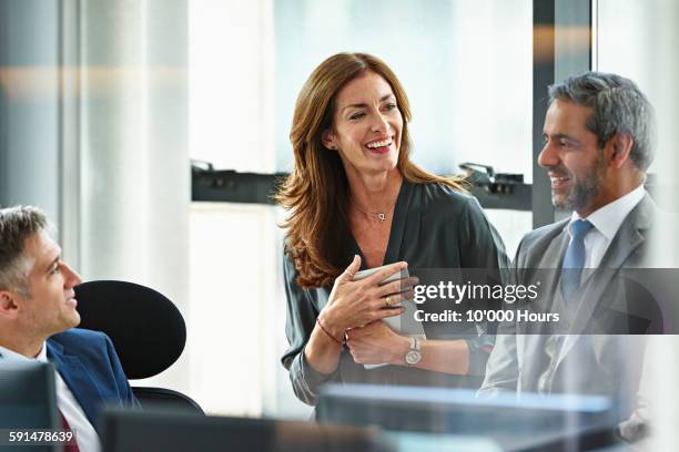 business colleagues in team meeting - mature business woman digital tablet corporate professional stockfoto's en -beelden