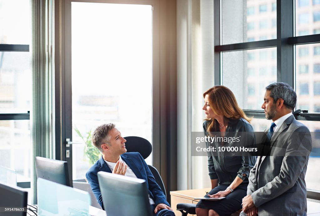 Business colleagues in informal meeting