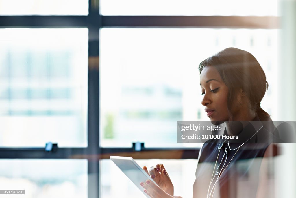 Businesswoman using a digital tablet in office
