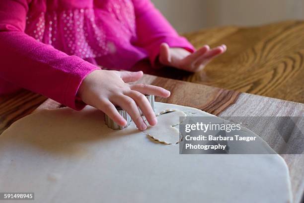 child cutting heart shaped cookies - barbara valentin stock pictures, royalty-free photos & images