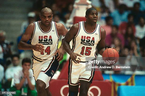 Charles Barkley and Magic Johnson of the United States National Team run up court during the 1992 Olympics against Spain in Barcelona, Spain at Palau...