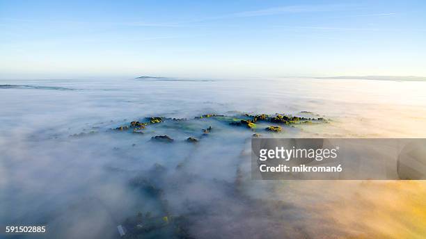 aerial view, sunrise on foggy day above the fog - republic of ireland stock pictures, royalty-free photos & images