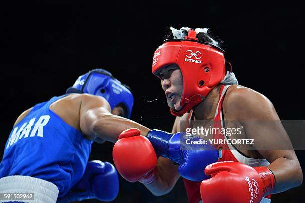 Kazakhstan's Dariga Shakimova fights Morocco's Khadija Mardi during the Women's Middle Quarterfinal 2 match at the Rio 2016 Olympic Games at the...