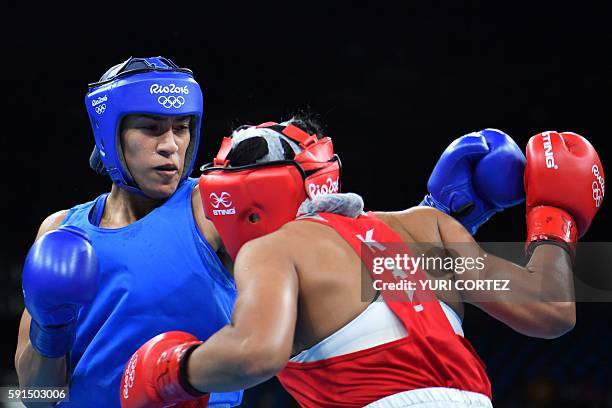 Kazakhstan's Dariga Shakimova fights Morocco's Khadija Mardi during the Women's Middle Quarterfinal 2 match at the Rio 2016 Olympic Games at the...