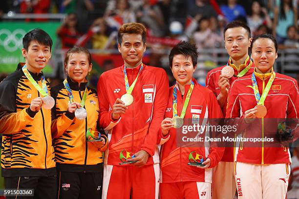 Silver medalists, Peng Soon Chan and Liu Ying Goh of Malaysia, gold medalists, Tontowi Ahmad and Liliyana Natsir of Indonesia and bronze medalists...