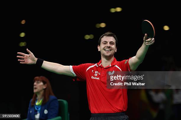 Timo Boll of Germany celebrates the Bronze Medal winning point during the Men's Team Bronze Medal match between Korea and Germany at the Rio Centro...