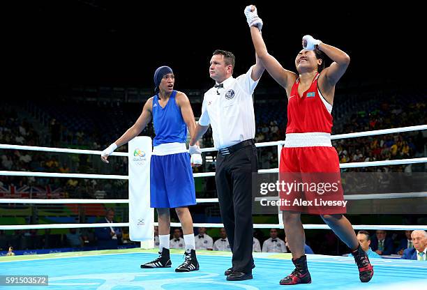 Dariga Shakimova of Kazakhstan defeats Khadija Mardi of Morocco by points in the Women's Middleweight Quarterfinal bout during Day 12 of the Rio 2016...