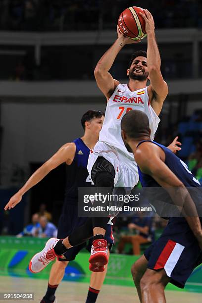 Ricky Rubio of Spain puts up a shot over Tony Parker of France during the Men's Quarterfinal match on Day 12 of the Rio 2016 Olympic Games at Carioca...