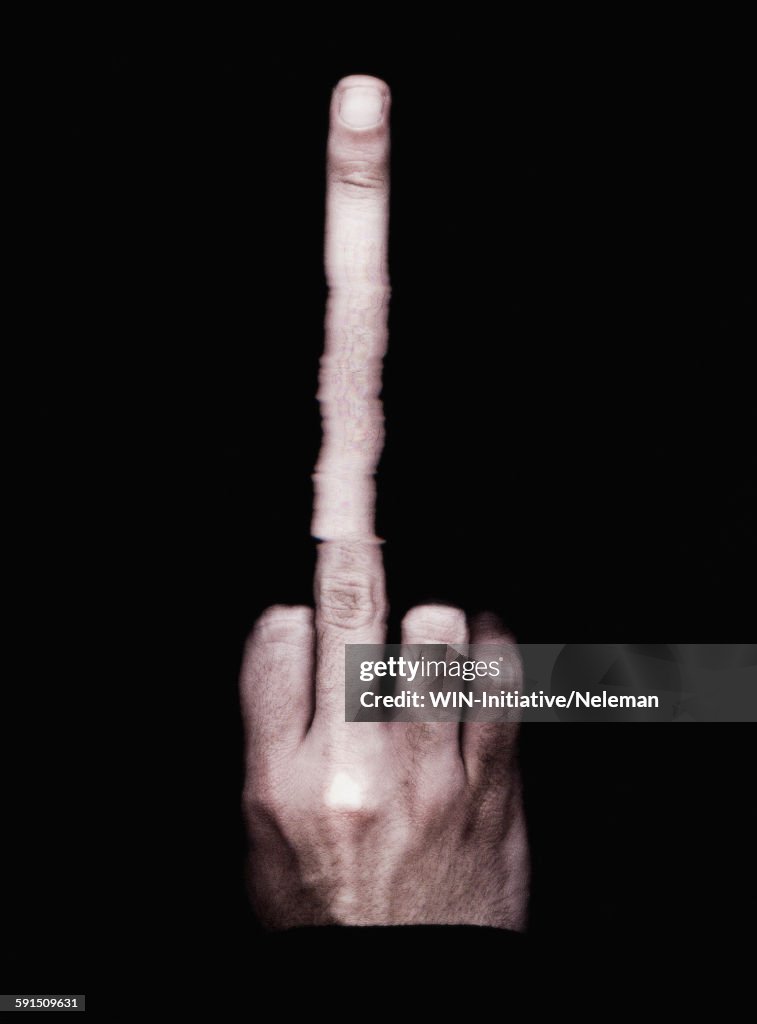 Persons hand with a long middle finger