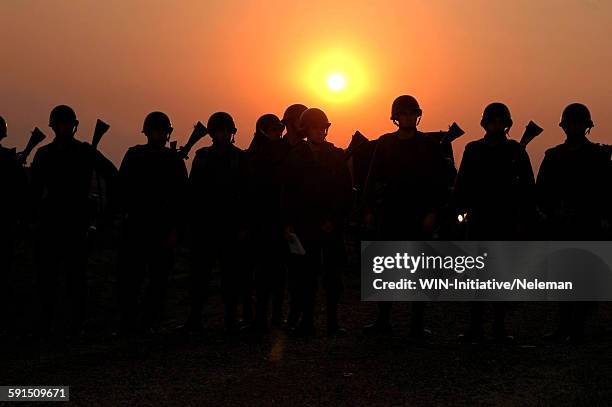 silhouetted of soldiers marching - armed forces people stock pictures, royalty-free photos & images