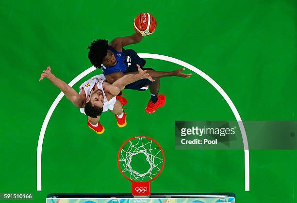 Mickael Gelabale of France goes to the basket against Pau Gasol of Spain during the Men's Quarterfinal match on Day 12 of the Rio 2016 Olympic Games...