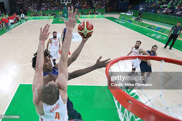 Mickael Gelabale of France goes to the basket against Pau Gasol of Spain during the Men's Quarterfinal match on Day 12 of the Rio 2016 Olympic Games...