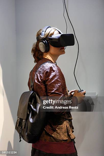 Visitor watches exclusively the new Syfy hybrid show 'Halcyon' at the Gamescom 2016 gaming trade fair during the media day on August 17, 2016 in...