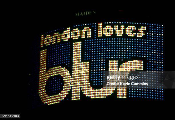Neon sign in Piccadilly Circus, London, reading, 'London Loves Blur', Blur, 1994. 'London Loves' is a song on the group's album 'Parklife'.