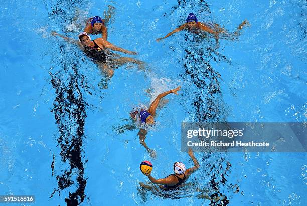 Judith Forca Ariza of Spain looks to pass the ball during the Women's Water Polo match between Spain and China at Olympic Aquatics Stadium on August...