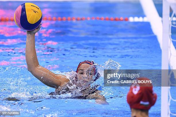 S Maddie Musselman looks at Hungary's Orsolya Kaso during their Rio 2016 Olympic Games water polo semifinal game at the Olympic Aquatics Stadium in...